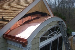 Copper_roof_on_a_round_dormer_with_flat_seams__B_