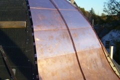 standing-seamroof_with_flat_locks_on_a_tower_during_installation__B_
